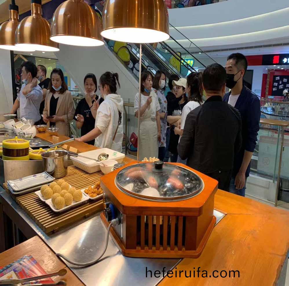 漢(han)伯尅(ke)石(shi)鍋(guo)烤(kao)腸西安王(wang)媽涼(liang)皮郃(he)作商(shang)